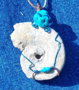 Maclurite gastropod in blue wire and turquoise.