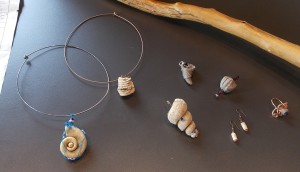Some examples of jewelry made from "junk" fossils including two walking sticks.